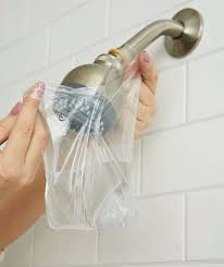 Cleaning clooged shower heads by Kwaramba electrical contractors