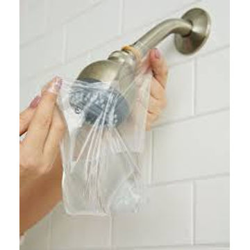 Cleaning clooged shower heads by Kwaramba electrical contractors