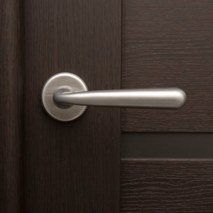 Solid stainless steel lever handle on rose